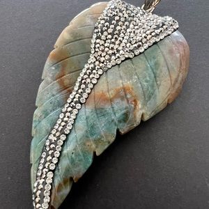 3 inches agate leaf shape with crystal pendent .